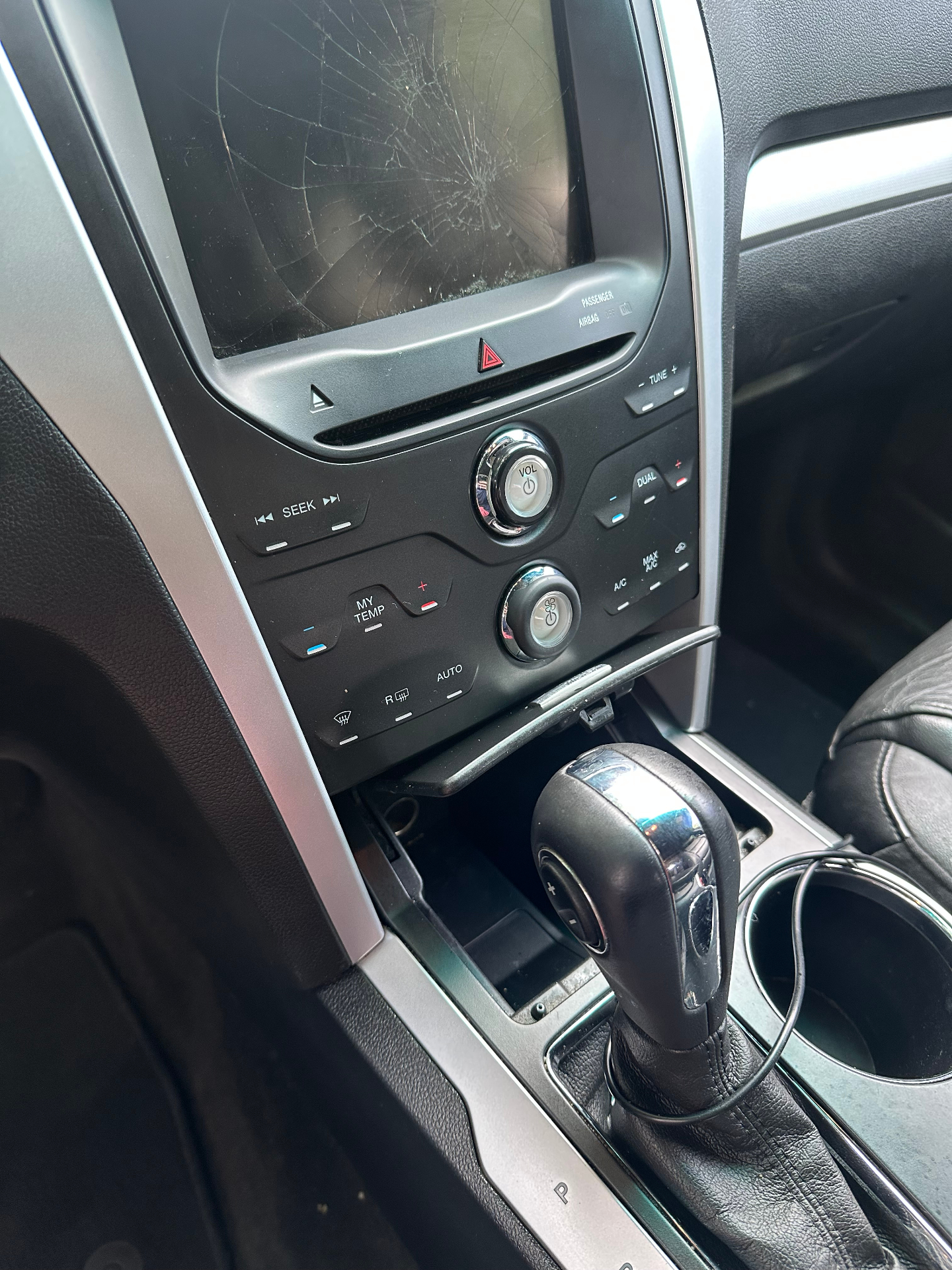 Close-up of a vehicle center console during a Bliss Performance Detailing interior service